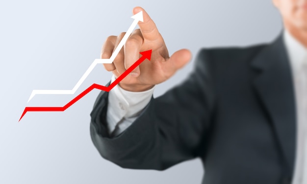 business man hand in suit with two arrows