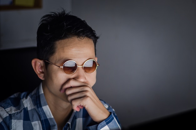 Business man having serious and contemplative after viewing the summary chart of the company's report