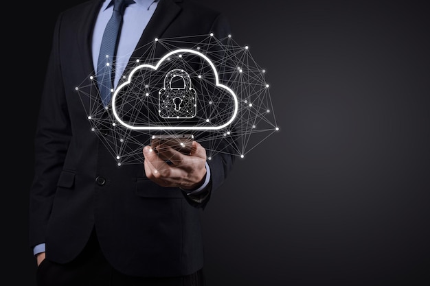 Business man hold,holding cloud computing data and security on\
global networking,padlock and cloud icon. technology of\
business.cybersecurity and information or network\
protection.internet project