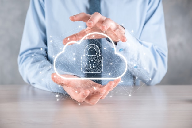 Photo business man hold,holding cloud computing data and security on global networking,padlock and cloud icon. technology of business.cybersecurity and information or network protection.internet project