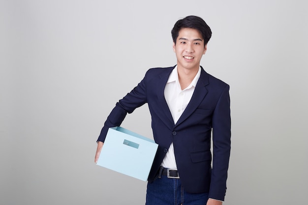 Business man and holding carton box