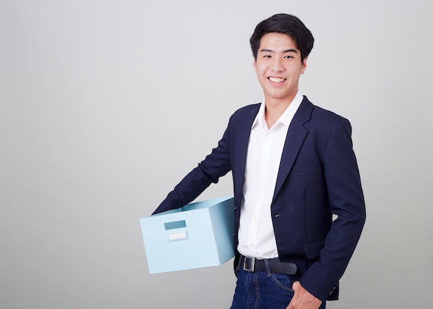 Business man and holding carton box