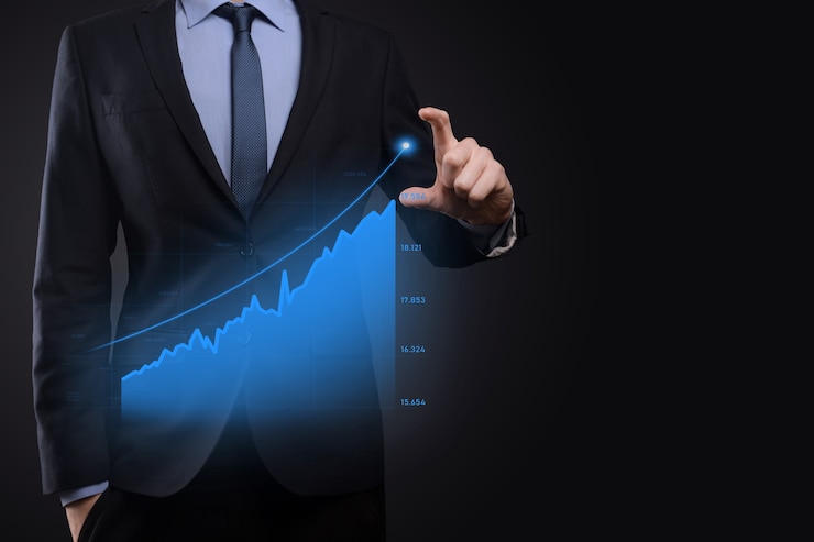 Photo business man holding holographic graphs and stock market statistics gain profits. concept of growth planning and business strategy. display of good economy form digital screen.