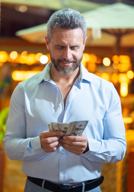 Business man holding money cash businessman with money man counting dollars bills money wealthy man