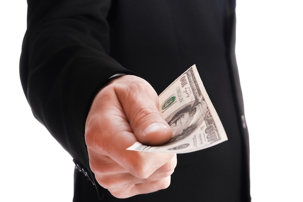 Business man holding money on white surface