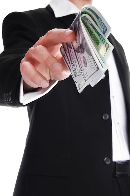 Business man holding money on white surface