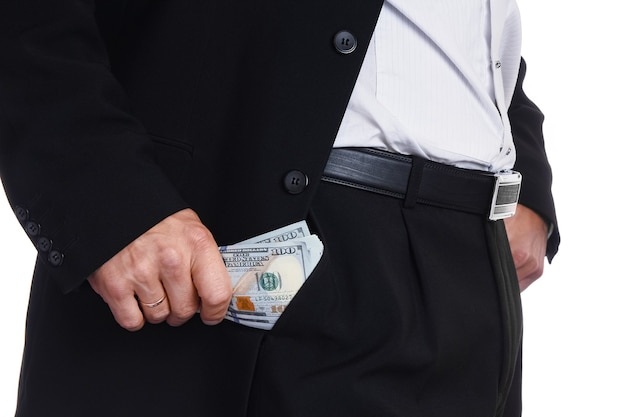 Business man holding money on white surface