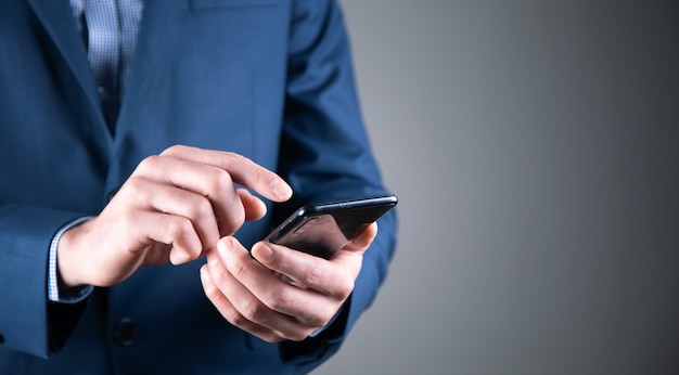 Business man holding phone device in hands