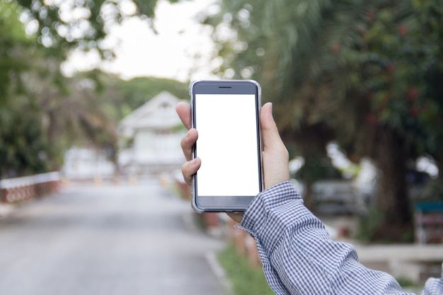 Business man holding smart phone mock up on screen