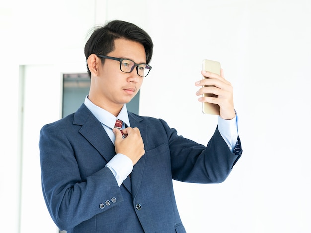 Business man holding smartphone 