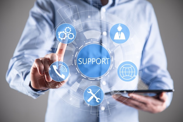 Business man holding tablet with support icon