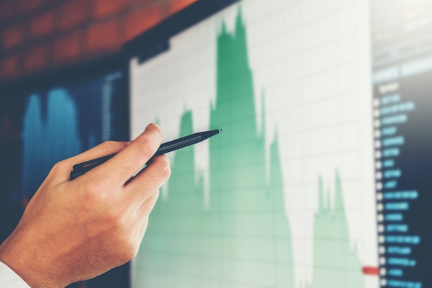 Business man Investment Entrepreneur Trading discussing and analysis graph stock 