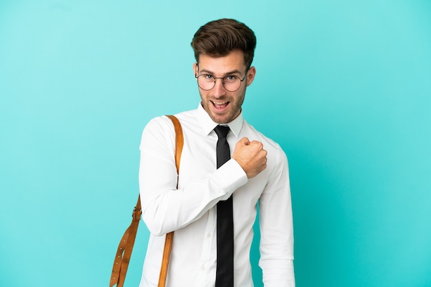 Business man over isolated background celebrating a victory