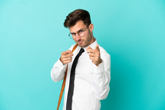 Business man over isolated background pointing to the front and smiling