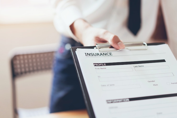 Photo business man in the office fill out insurance policy. to prevent future incidents. 