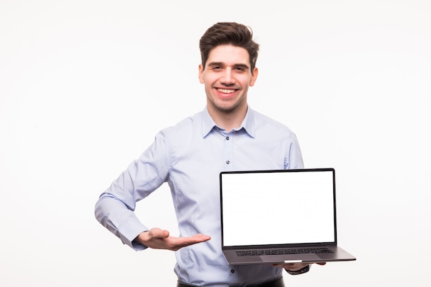 Business man pointing at a laptop isolated on white space