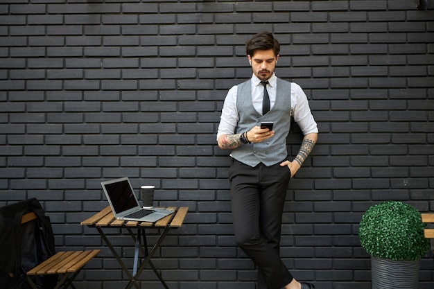 Business man portrait outside wearing suit