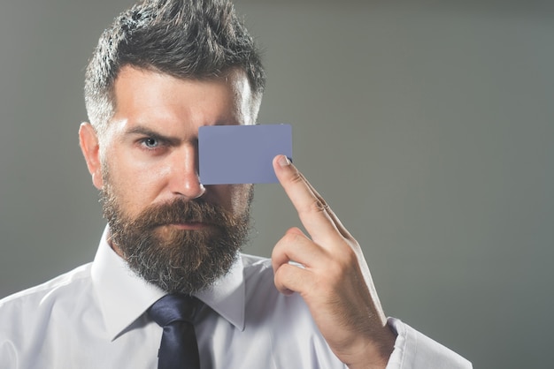 Business man presenting creditcard credit card as secure online payment businessman showing credit