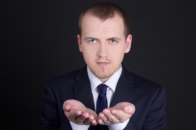 Business man presenting something on his hand