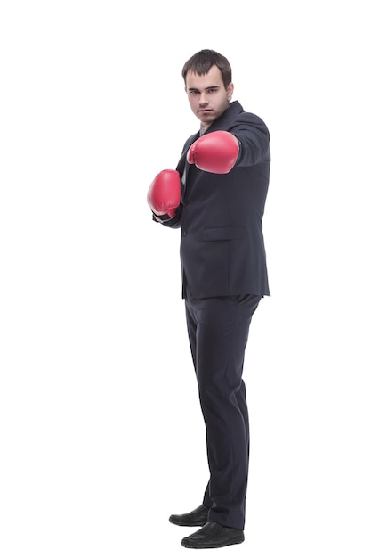 Business man ready to fight with boxing gloves looking at camera