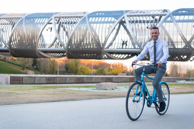 Business man riding a vintage bicycle in the cityxA