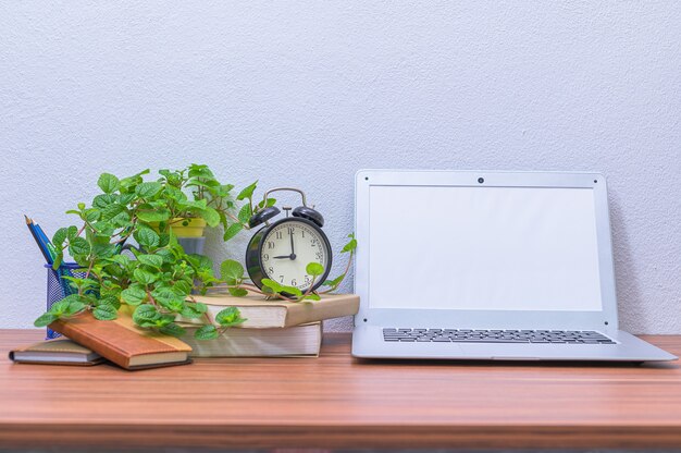 Business man's notebook computer is at the desk