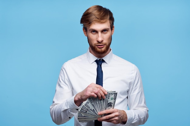Business man in shirt with tie bundle of money in the hands of the office High quality photo