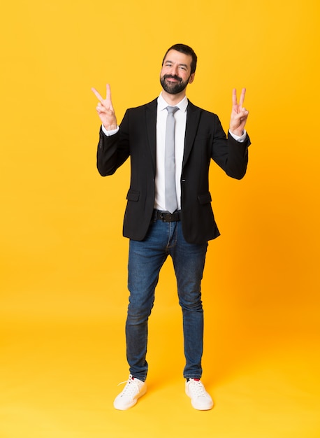 business man showing victory sign with both hands