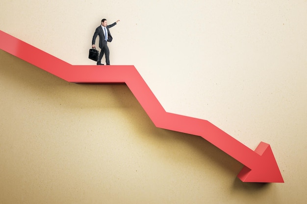 Business man standing on abstract red downward chart arrow on light background Down drop finance and crisis concept Mock up place