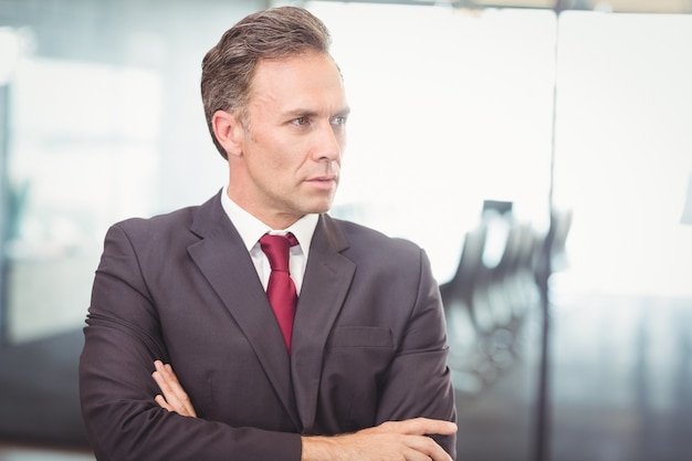 business man standing with arms crossed