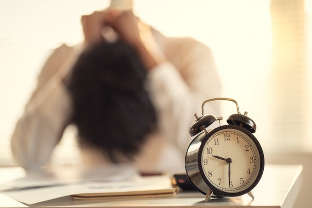 Photo business man stressed and worried about late time to complete of construction project