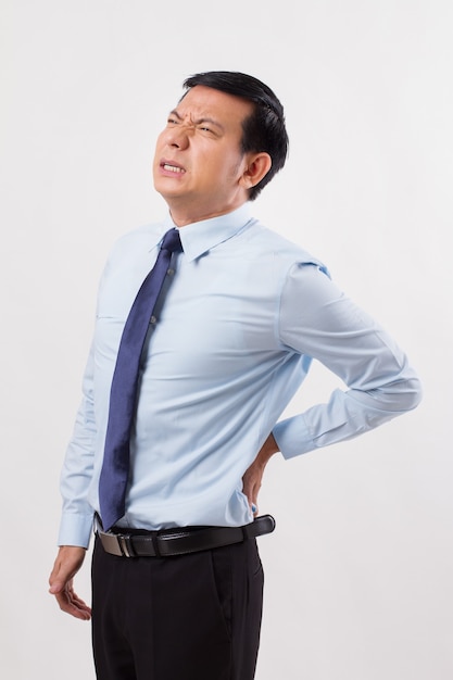 Business man suffering from back pain, spinal injury