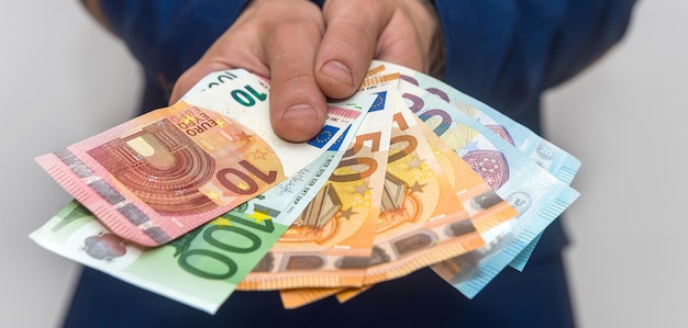 business man in suit counting euro money