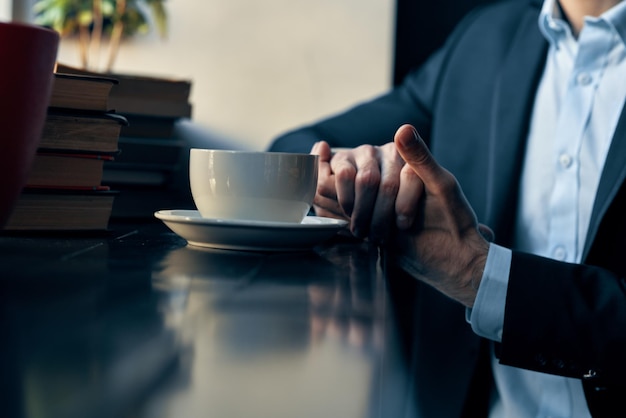 Business man in a suit sitting in a cafe leisure manager finance