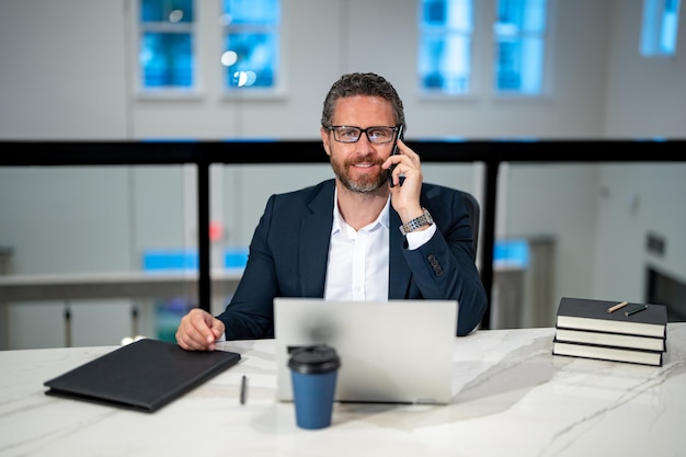 business man talking on phone at office workplace occupation person in work space business portrait confident business worker business finance and employment successful office worker