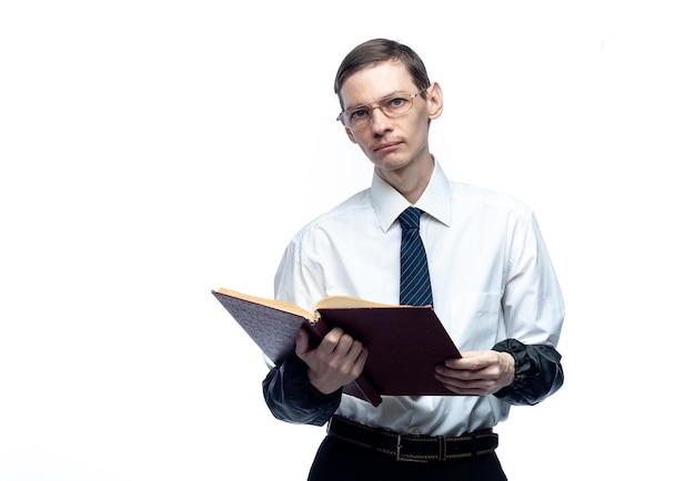 A business man in a tie and glasses with a magazine in his hands on a white isolated backgroundxA