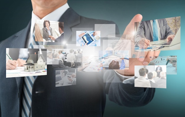 Business man touching screen with signs on background