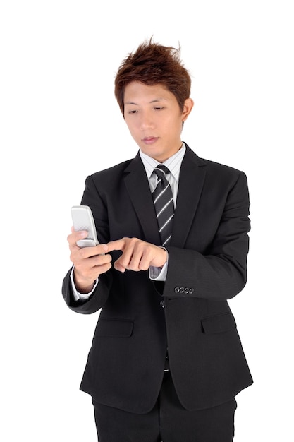 Business man using cellphone to type message.