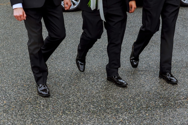 Business man walks on a pedestrian crossing