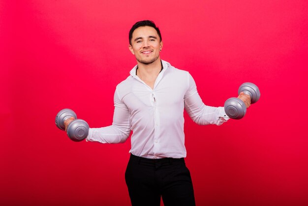 Business man with fitness dumbbells wear shirt studio shooting on red background