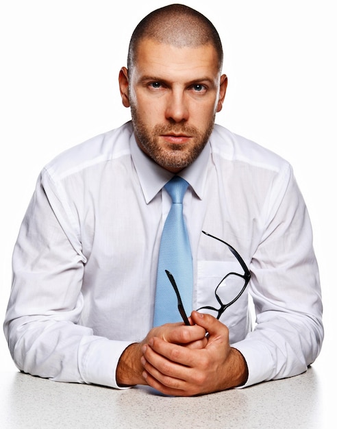 Business man with glases at the table isolated white