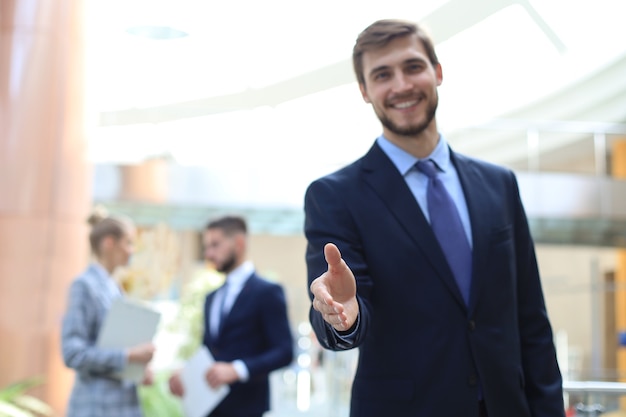 A business man with an open hand ready to seal a deal.