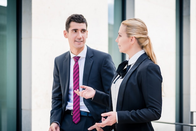 Business man and woman discussing