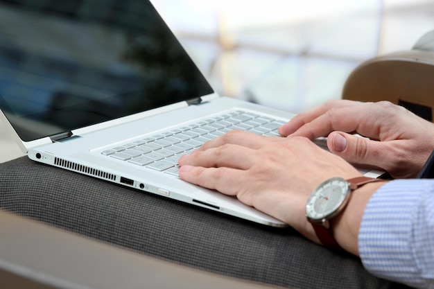 Business man working and analyzing financial figures on a laptop