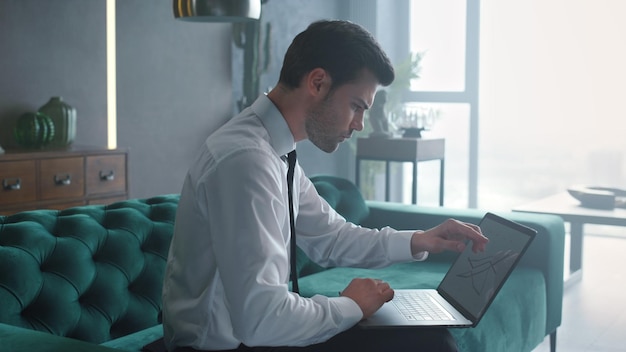 Business man working on laptop at office Manager looking at charts on computer