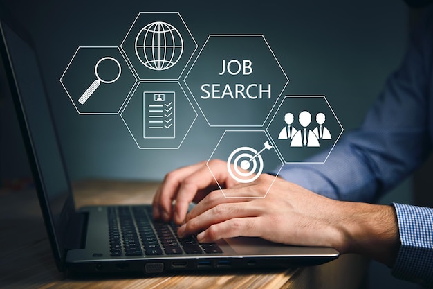 Photo business man working on laptop with  job search on a screen