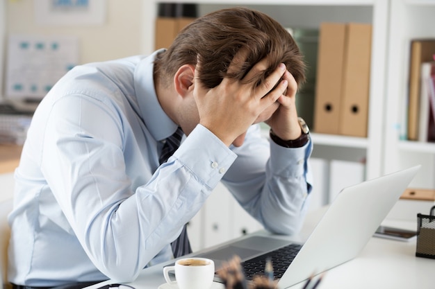 business man at workplace in office working