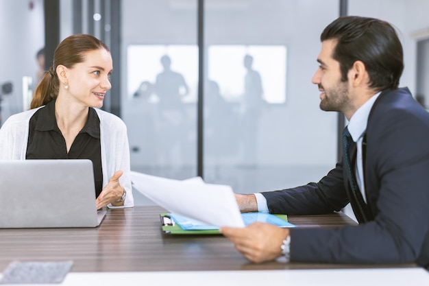 Business manager businesspeople talking together conversation at office meeting room happy talk discussion with team