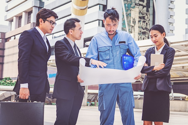 Business manager and engineer meeting project at construction site