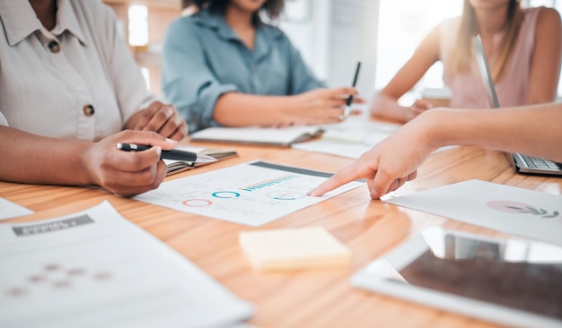 Business marketing analytics and finance team discussing data with collaboration and teamwork in a office Closeup staff working on tax audit report and accounting infographics documents together